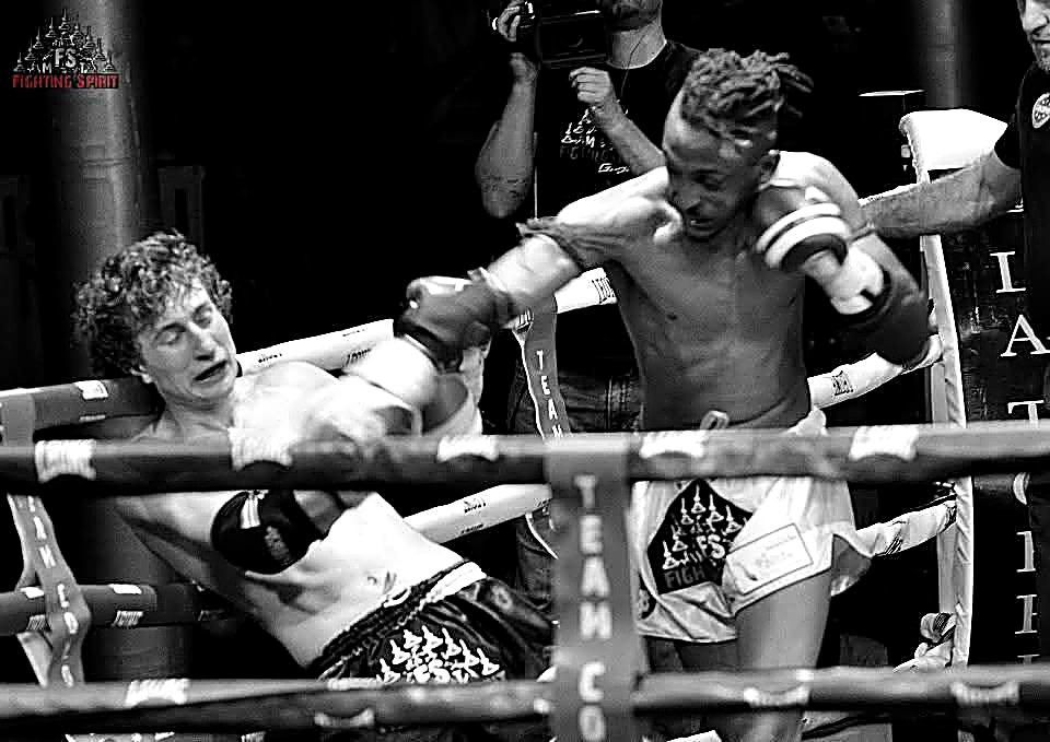 Kebrom Neguse landing a left hook in black-and-white match action